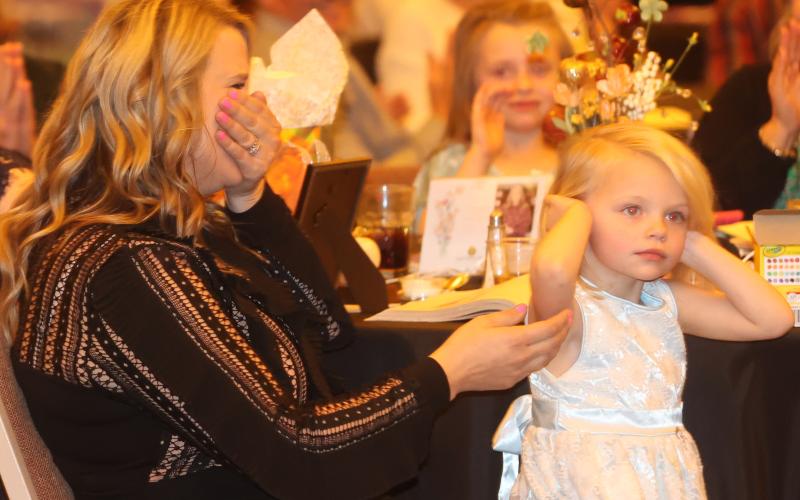 Kary Black (left) reacts after hearing her named called as the Suwannee County Teacher of the Year on Thursday. (PAUL BUCHANON/Special to the Reporter)