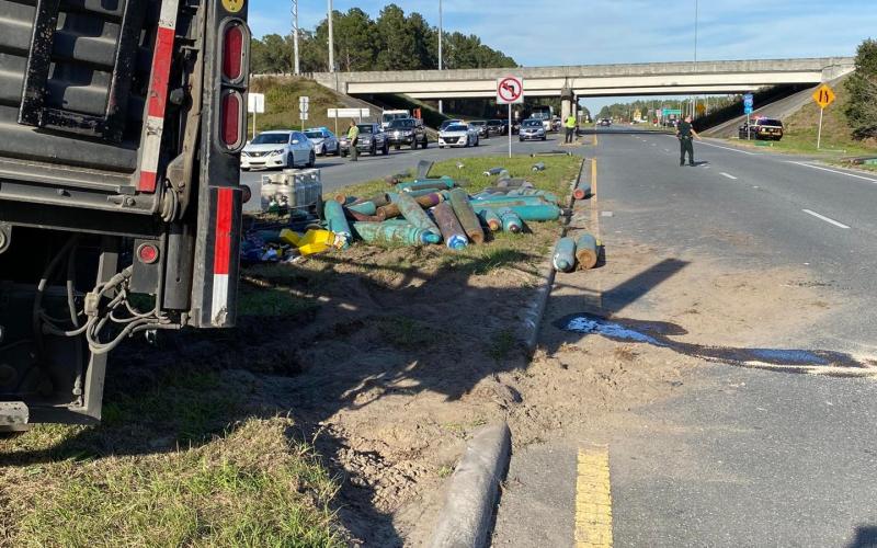 A truck hauling gas tanks overturned in the media of U.S. Hwy. 129 near the Interstate 10 interchange Friday north of Live Oak. The only tank that leaked was an oxygen tanks, according to first responders. (COURTESY)