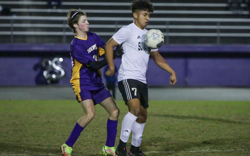 Suwannee's Omar Carreon corrals the ball against Columbia on Jan. 7. (BRENT KUYKENDALL/Lake City Reporter)