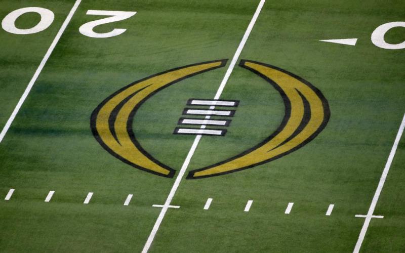The College Football Playoff logo is shown on the field at AT&amp;T Stadium on Jan. 1, 2021, in Arlington, Texas. (AP FILE)