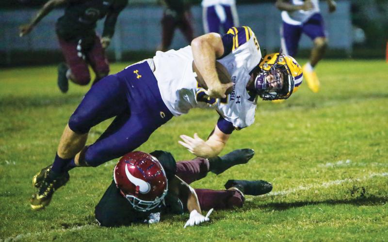 Columbia linebacker Jaden Dunn is tackled after intercepting a pass against Raines this past season. (BRENT KUYKENDALL/Lake City Reporter)