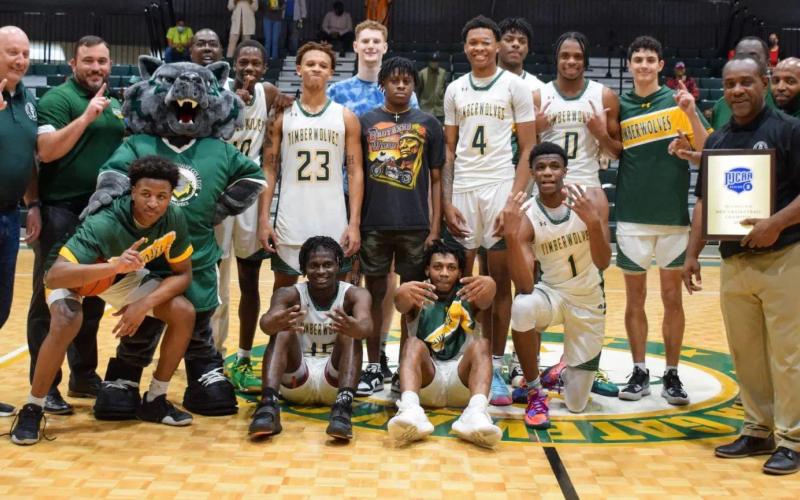 FGC's basketball team celebrates after winning the Region 8 championship on Saturday. (COURTESY)