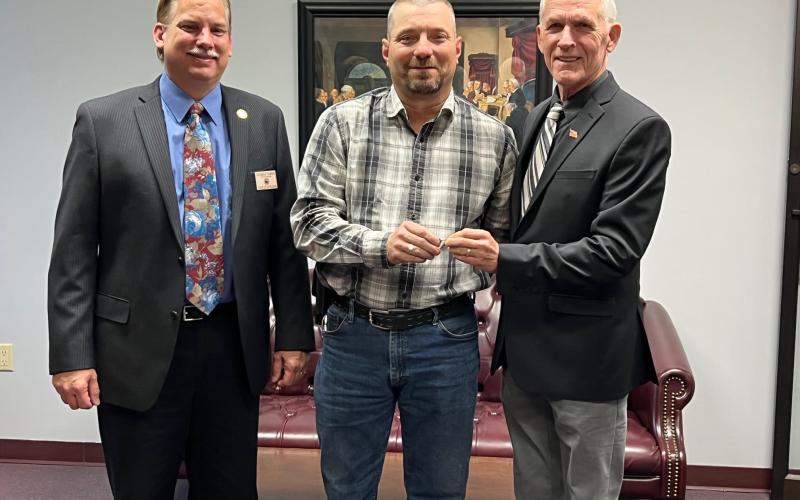 Robert Hammac (center) received the key to the City of Live Oak from Mayor Frank Davis (right). City Manager George Curtis looks on. (COURTESY)