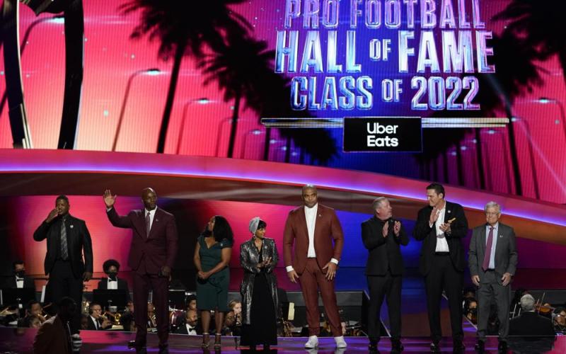 The 2022 NFL Football Hall of Fame class is seen during the NFL Honors show on Thursday in Inglewood, Calif. The class is: Tony Boselli, LeRoy Butler, Sam Mills, Richard Seymour, Bryant Young, Cliff Branch, Art McNally and Dick Vermeil. Filling in for Sam Mills is Melanie Mills and filling in for Tony Boselli is Elain Anderson. (MARK J. TERRILL/Associated Press)
