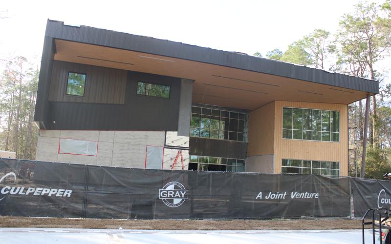 Construction workers continue working on the new STEM building on the Florida Gateway College campus Wednesday afternoon. The $12.8 million project is scheduled to be substantially complete by mid-April with hopes of opening in June. (TONY BRITT/Lake City Reporter)