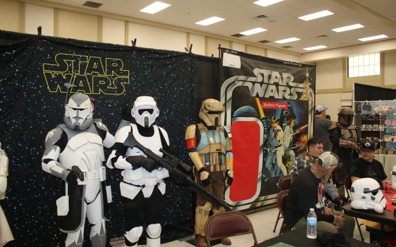 Dave Tischhauser (left) and David Burks (middle) pose in their Star Wars cosplay Saturday afternoon. (TONY BRITT/Lake City Reporter)