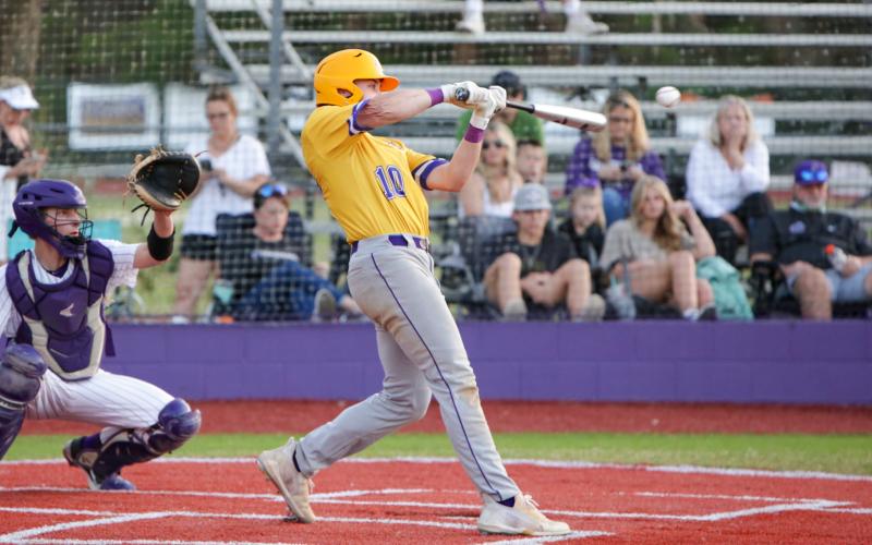 Columbia’s Brent Howard connects for a hit Friday night at Gainesville in the teams’ District 3-5A opener. (BRENT KUYKENDALL/Lake City Reporter)
