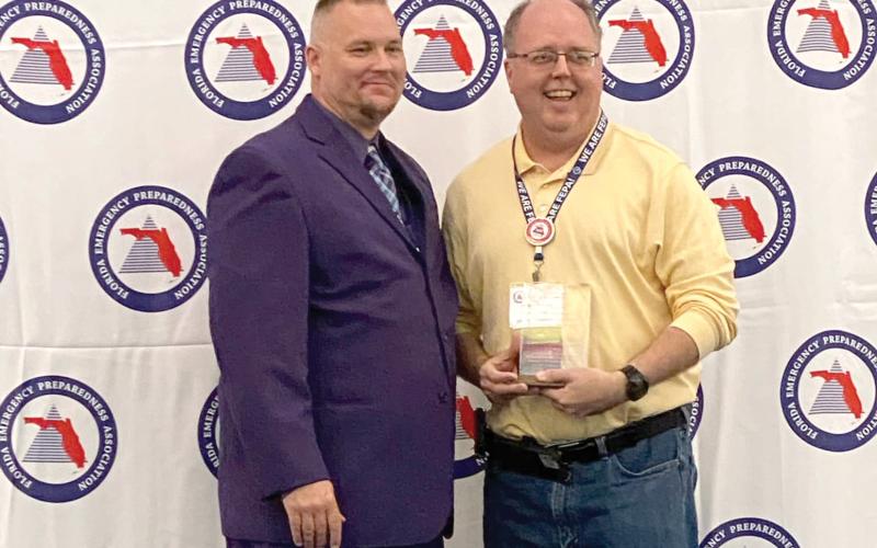 Shayne Morgan (right), Columbia County’s emergency management director, was honored as the Florida Emergency Preparedness Association’s Chad Reed Emergency Management Professional of the Year. (COURTESY)
