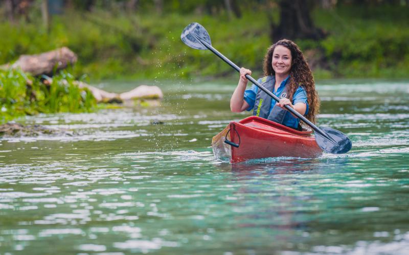 A woman enjoys the natural resources of North Florida while kayaking. The Suwannee River Water Management District is launching a “Dive In” initiative to help protect the springs and water quality in North Florida. (COURTESY)