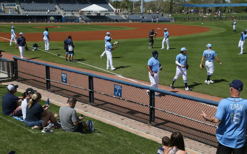 The Tampa Bay Rays are shown warming up before a game in February 2021 in Port Charlotte. (LUIS SANTANA/TNS)
