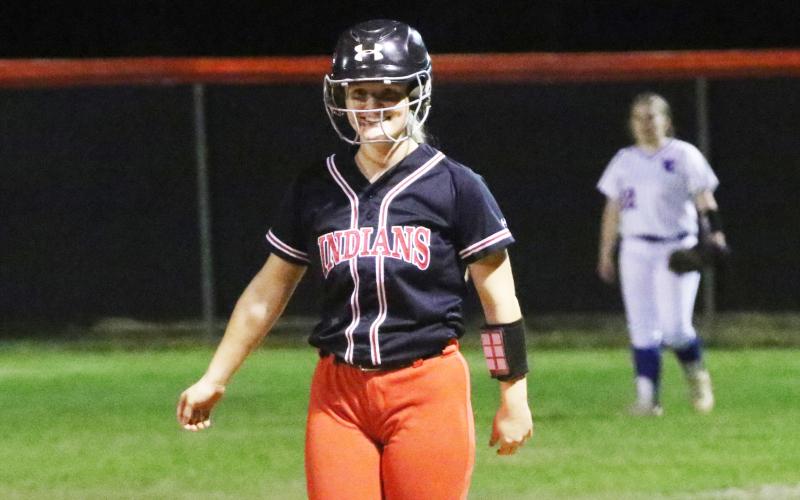 Fort White catcher Kaitlyn Suggs smiles at first base after hitting a single against Taylor County on Tuesday. (JORDAN KROEGER/Lake City Reporter)
