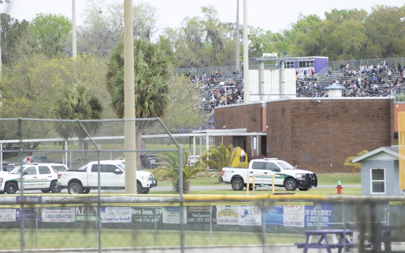 A Columbia County Sheriff’s Office vehicle sits parked near Tiger Stadium, where students waited on buses to safely evacuate Columbia High School. Law enforcement officials found no explosive devices on the scene. (JAMIE WACHTER/Lake City Reporter)
