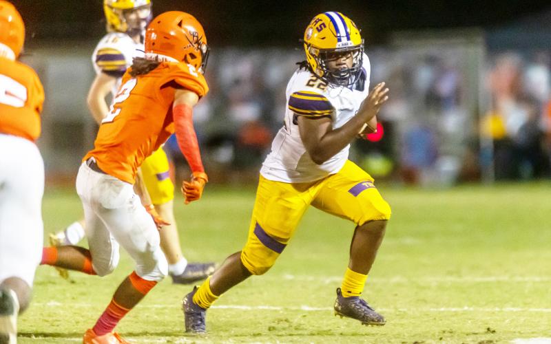 Columbia running back Tony Fulton rushes up the field against Orange Park last season. The two teams will play in District 3-3S this season with Middleburg and Ridgeview. (FRAN RUCHALSKI/Special to the Reporter)