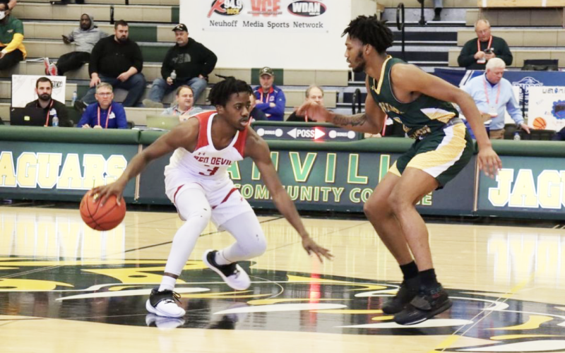Allen guard Brandon Lawrence is defended by FGC guard Antonio Card during Wednesday’s consolation bracket game in the NJCAA Division II tournament at Danville Area Community College’s Mary Miller Complex in Danville, Ill. (COURTESY)