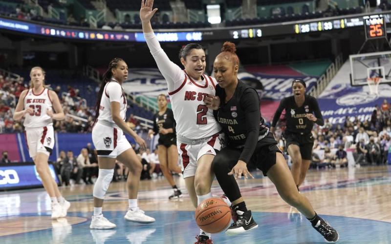 North Carolina State guard Raina Perez (2) defends against Florida State guard Sara Bejedi (4) during Friday's ACC tournament quarterfinal in Greensboro, N.C. (GERRY BROOME/Associated Press)