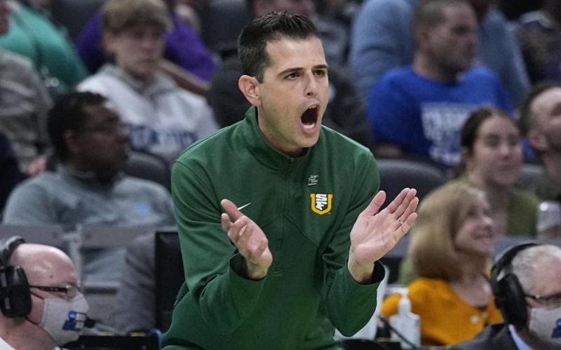 San Francisco head coach Todd Golden applauds his team during a game against Murray State in the first round of the NCAA tournament on Thursday in Indianapolis. (DARRON CUMMINGS/Associated Press)