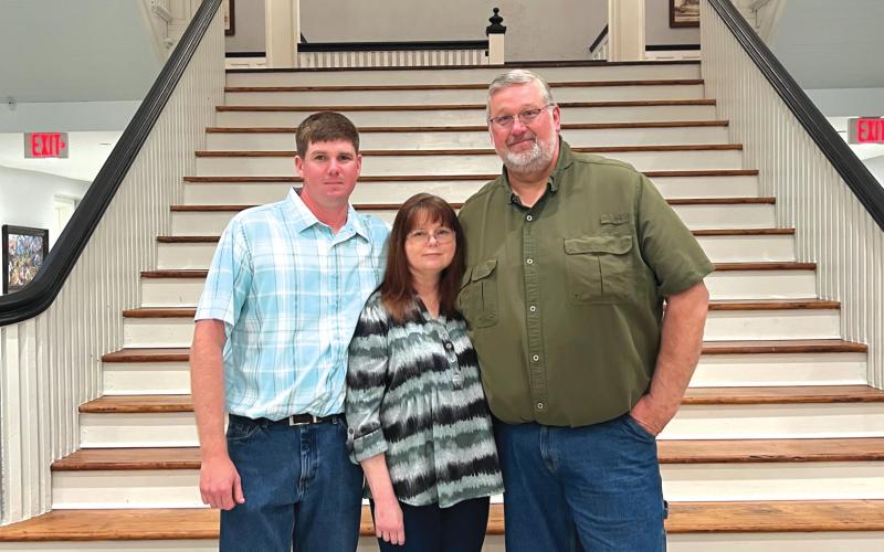 Thomas Henry (right) stands with his son, Josh, and wife, Zola, at his retirement party on Tuesday. Henry was recently hired by the City of High Springs as the Director of Public Works. (COURTESY)