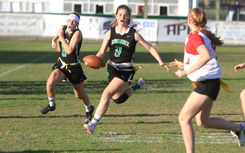 Suwannee quarterback Maci Campbell scrambles up the field against Bradford last season while Macy Bowers follows behind. (FILE)