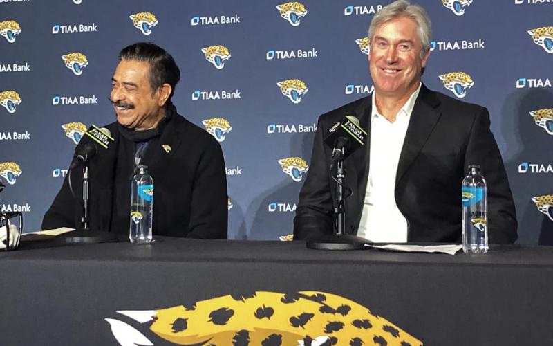 Jacksonville Jaguars owner Shahid Khan (left) and head coach Doug Pederson smile during a news conference on in Jacksonville. (MARK LONG/Associated Press)