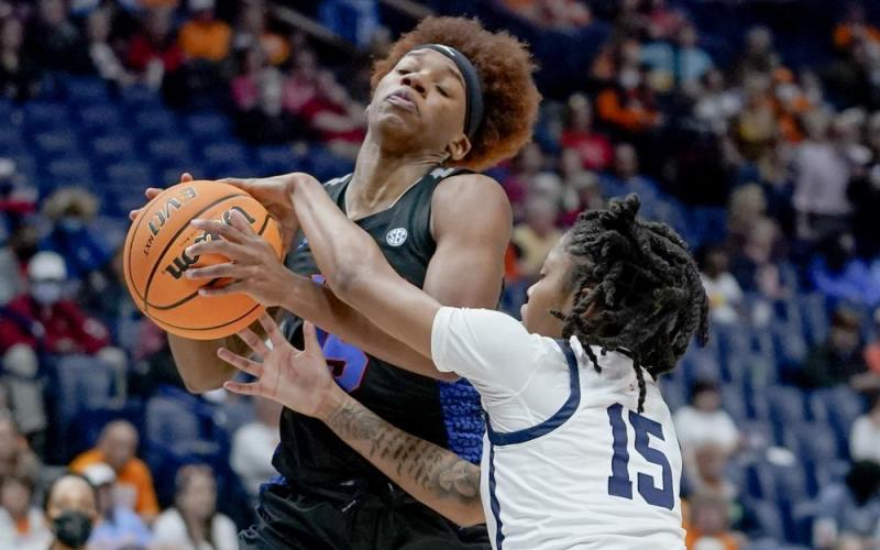 Florida's Nina Rickards, left, drives against Mississippi's Angel Baker (15)during Friday's game at Southeastern Conference tournament in Nashville, Tenn. (MARK HUMPHREY Humphrey)
