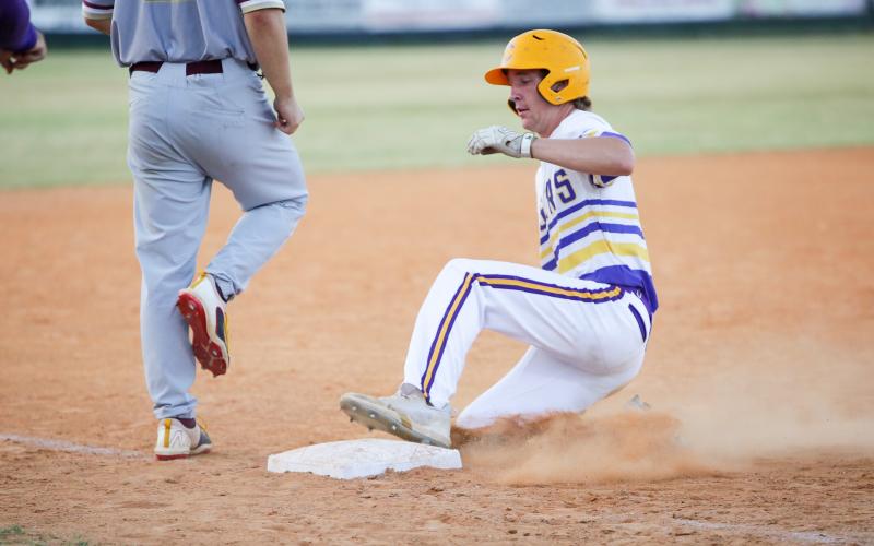 Columbia outfielder Kade Jackson slides safely into third base during Monday’s game against St. Augustine. (BRENT KUYKENDALL/Lake City Reporter)