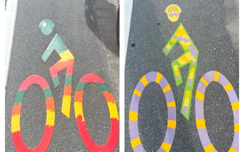 The pair of new bike lane designs are currently displayed on U.S. Highway 90 west of Interstate 75. Atlas Skinner (left) and Abigail Swisher (right) designed the colors and patterns of the logos. (COURTESY PHOTOS)
