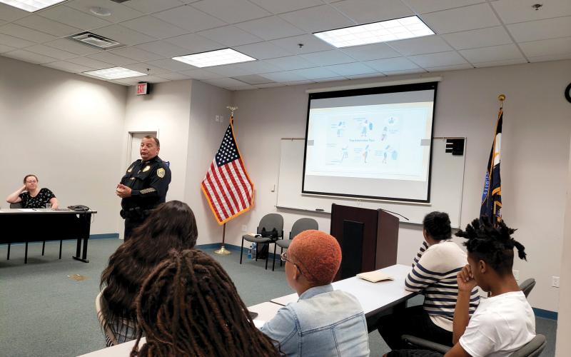 Lake City Police Chief Gerald Butler talks with teens about interviewing during the police department’s Sumer Youth Employment Program in 2019. (COURTESY)