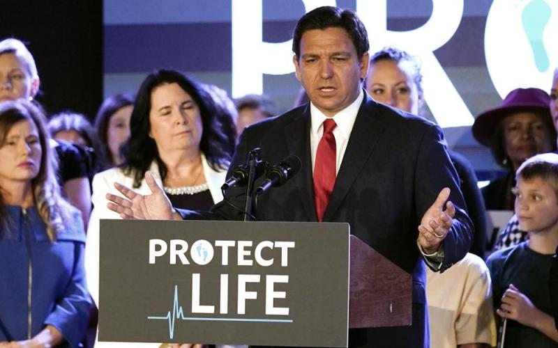 Florida Gov. Ron DeSantis speaks to supporters before signing a 15-week abortion ban into law Thursday in Kissimmee. The move comes amid a growing conservative push to restrict abortion ahead of a U.S. Supreme Court decision that could limit access to the procedure nationwide. (JOHN RAOUX/Associated Press)