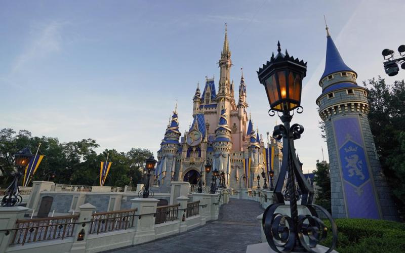 The newly painted Cinderella Castle at the Magic Kingdom at Walt Disney World is seen with the the crest to celebrate the 50th anniversary of the theme park on Aug. 30, 2021. (JOHN RAOUX/Associated Press)