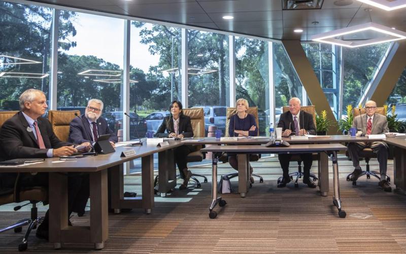 Reedy Creek Improvement District Administrator John Classe, from left, Ed Milgrim, legal counsel, Leila Jammal, Board of Supervisors, Jane Adams, BOS, Larry Hames, President of the BOS, and Don Greer, BOS, meet Wednesday. (WILLIE J. ALLEN JR./Orlando Sentinel/AP)