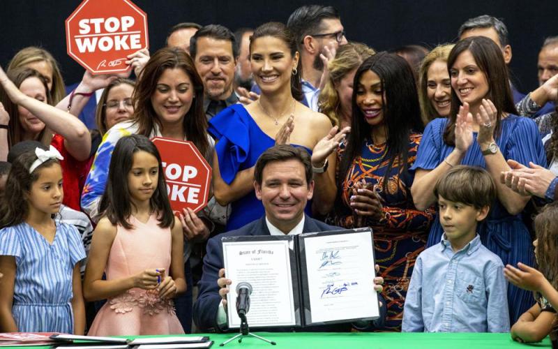 Florida Gov. Ron DeSantis reacts after publicly signing HB7, “individual freedom,” also dubbed the “stop woke” bill during a news conference at Mater Academy Charter Middle/High School in Hialeah Gardens on Friday. (DANIEL A. VARELA/Miami Herald/Associated Press)