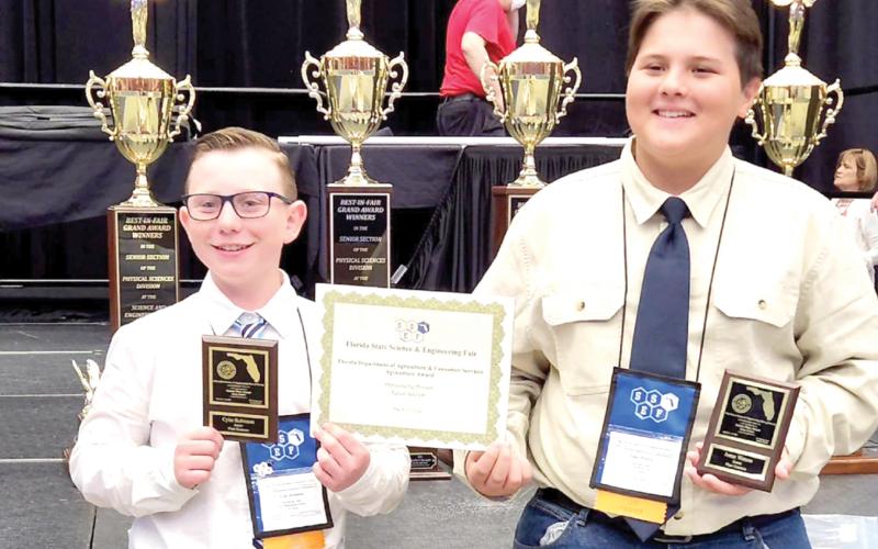 Fort White Middle School students Cyler Robinson (left) and Jonaz Watson earned statewide recognition for their science project at the 67th State Science and Engineering Fair of Florida last week in Lakeland. (COURTESY)