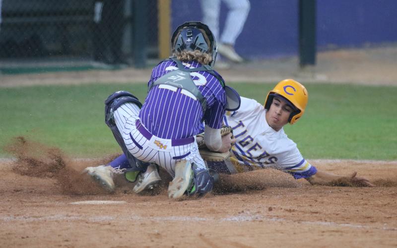 Columbia’s Grant Bowers is tagged out at home by Union County Blake Agner in the second inning on Friday. (JORDAN KROEGER/Lake City Reporter)