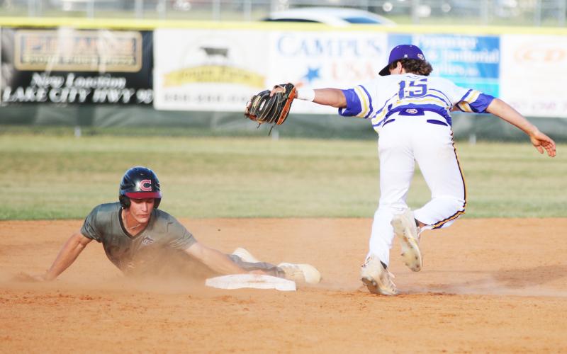 Columbia shortstop Truitt Todd misses the tag on Chiles shortstop Grant Gallagher as he steals second base on Wednesday. ( JORDAN KROEGER/Lake City Reporter)