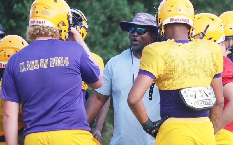 Columbia head coach Demetric Jackson talks to his players during Thursday’s practice. (JORDAN KROEGER/Lake City Reporter)