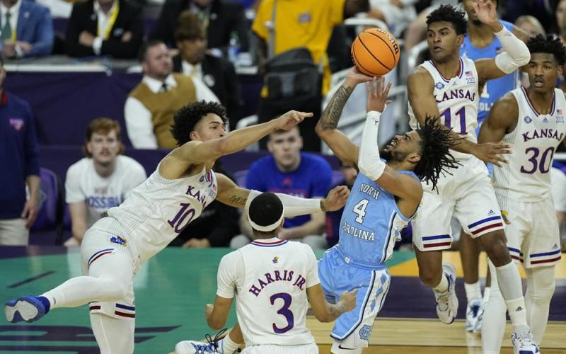 North Carolina guard R.J. Davis (4) shoots against Kansas forward Jalen Wilson (10) during the national championship game on Monday in New Orleans. (GERALD HERBERT Herbert)
