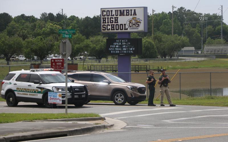 Law enforcement blocks the entrance to Columbia High School on Monday morning after a bomb threat was made against the school. A sweep of the building turned up nothing suspicious. (MORGAN MCMULLEN/Lake City Reporter)