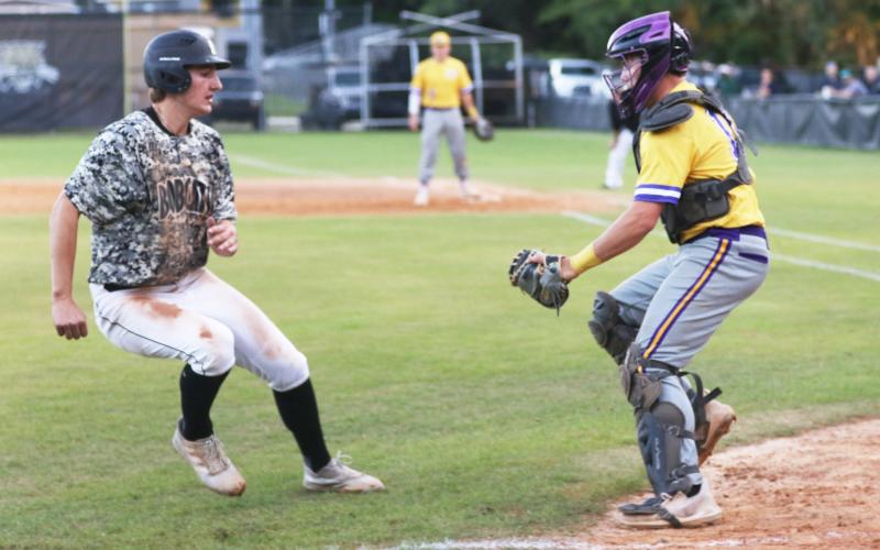 Columbia catcher Brent Howard tags out Buchholz runner JJ Gardner as he tries to score on Tuesday. (MORGAN MCMULLEN/Lake City Reporter)