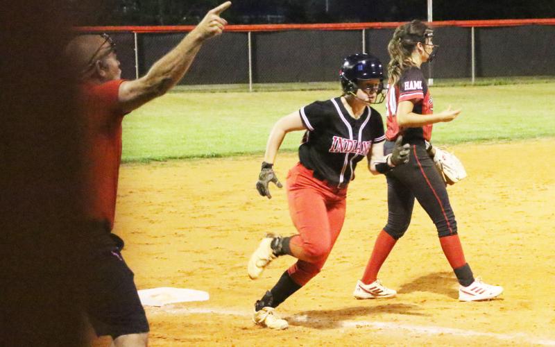 Fort White’s Hannah LeBleu turns off of third base toward home plate to score a run against Hamilton County on Thursday. (MORGAN MCMULLEN/Lake City Reporter)