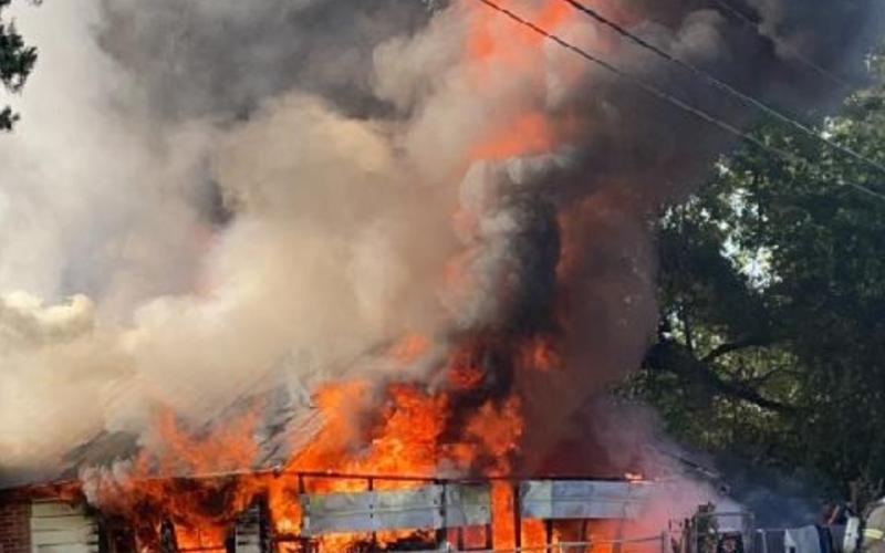 It took firefighters 10 minutes to extinguish flames in a house that was fully engulfed Tuesday morning. (COURTESY LAKE CITY POLICE DEPARTMENT)