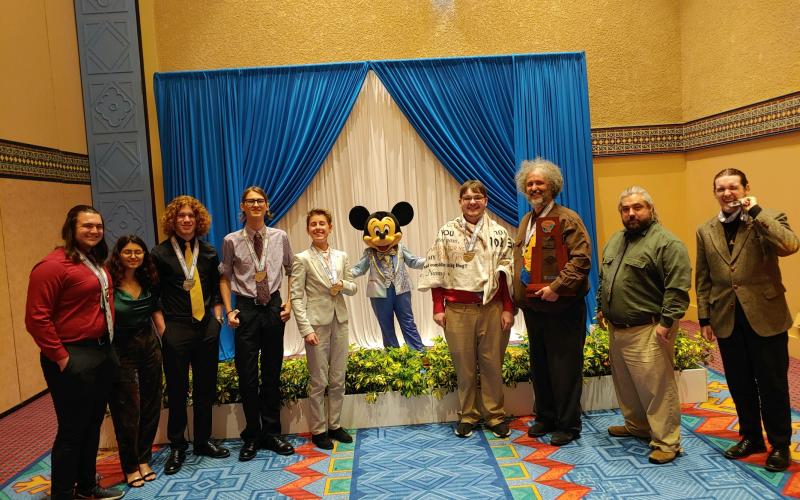 The Columbia High Academic Team placed second in the state last weekend at the competition at Walt Disney World. Team members are captain Jonathan Hunter (from left), Bianka Lorenzo, Ethan Cruz, Logan Mears, Allison Matsubara, Mickey Mouse, Xander Flegert, coach J.L. Kirby, assistant coach Scott Stefansen and Payton Young. Flegert was named to Team Florida as one of the top six players in the state. (COURTESY)