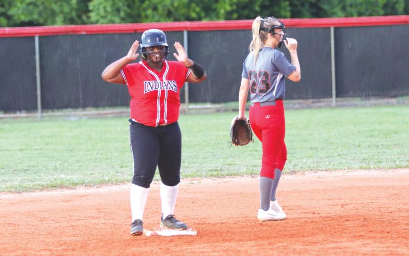 Fort White’s N’Coreyia Atkins celebrates after an RBI double against Lafayette during the Region 3-1A semifinals on Thursday night. (MORGAN MCMULLEN/Lake City Reporter)