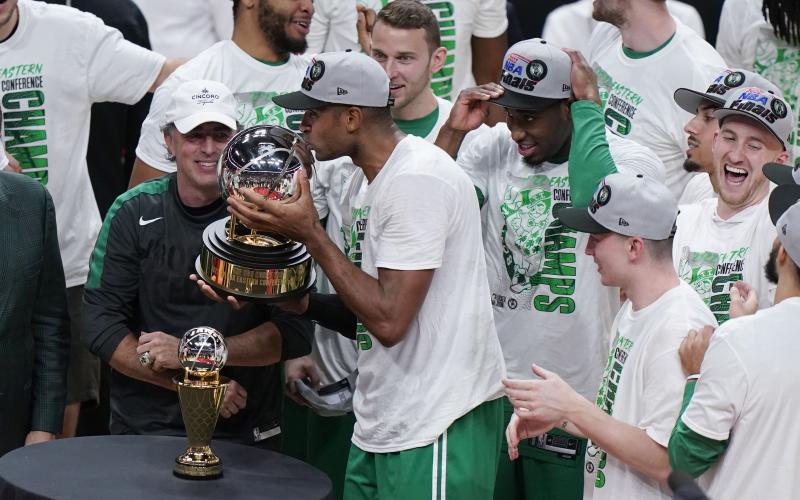 Boston Celtics center Al Horford kisses the NBA Eastern Conference trophy after defeating the Miami Heat in Game 7 of the Eastern Conference finals on Sunday in Miami. (WILFREDO LEE/Associated Press)