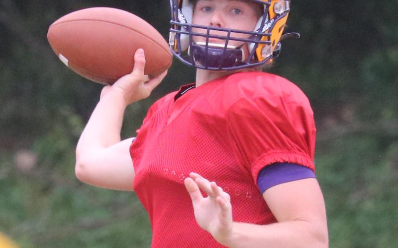 Columbia quarterback Evan Umstead throws a pass during Friday’s practice. (JORDAN KROEGER/Lake City Reporter)