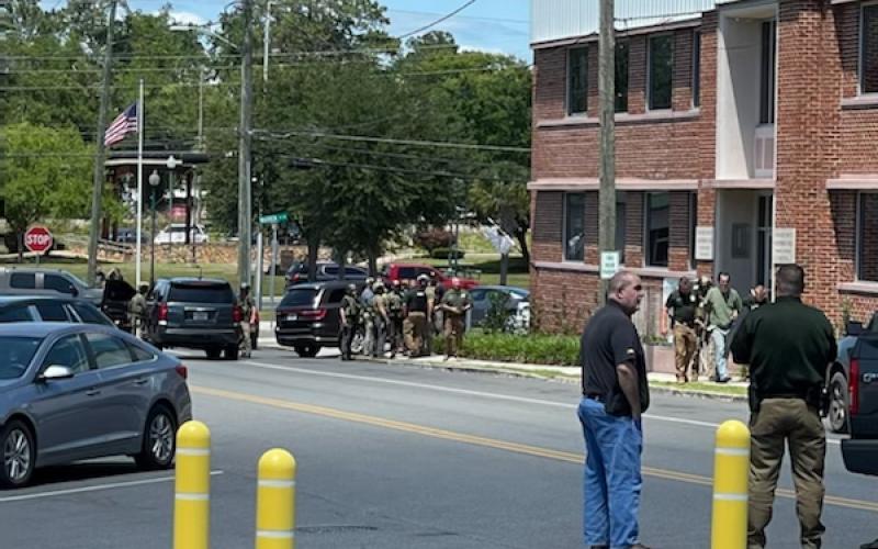 Dustin Eward after being detained by FBI agents in front of the Suwannee County Courthouse Annex on Monday afternoon. (COURTESY)