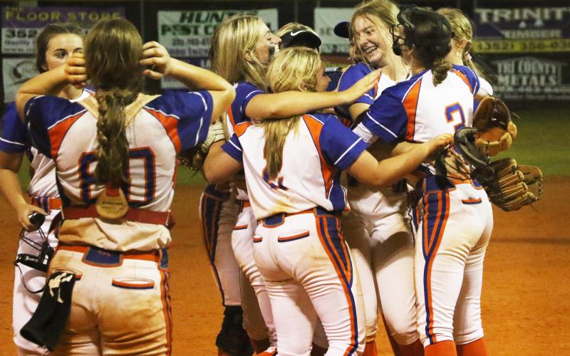 Branford’s softball team celebrates after defeating top-seeded Bell in the District 6-1A semifinals on Tuesday. (MORGAN MCMULLEN/Lake City Reporter)