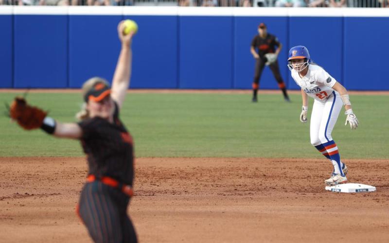 Florida's Kendra Falby watches Oklahoma State's Kelly Maxwell pitches during Saturday’s Women's College World Series game in Oklahoma City. (ALONZO ADAMS/Associated Press)