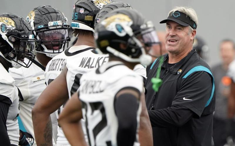 Jacksonville Jaguars head coach Doug Pederson, right, talks with players during practice on May 31 in Jacksonville. (JOHN RAOUX/Associated Press)