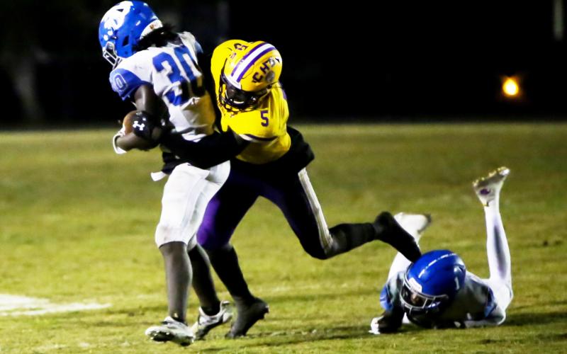 Columbia's Jaden Robinson makes a tackle against Riverside last season. (BRENT KUYKENDALL/Lake City Reporter)