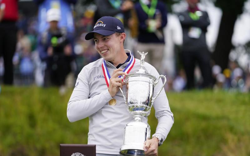 Matthew Fitzpatrick celebrates with the trophy after winning the U.S. Open at The Country Club on Sunday in Brookline, Mass. (JULIO CORTEZ/Associated Press)